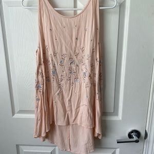 Peach blouse with embroidered flowers